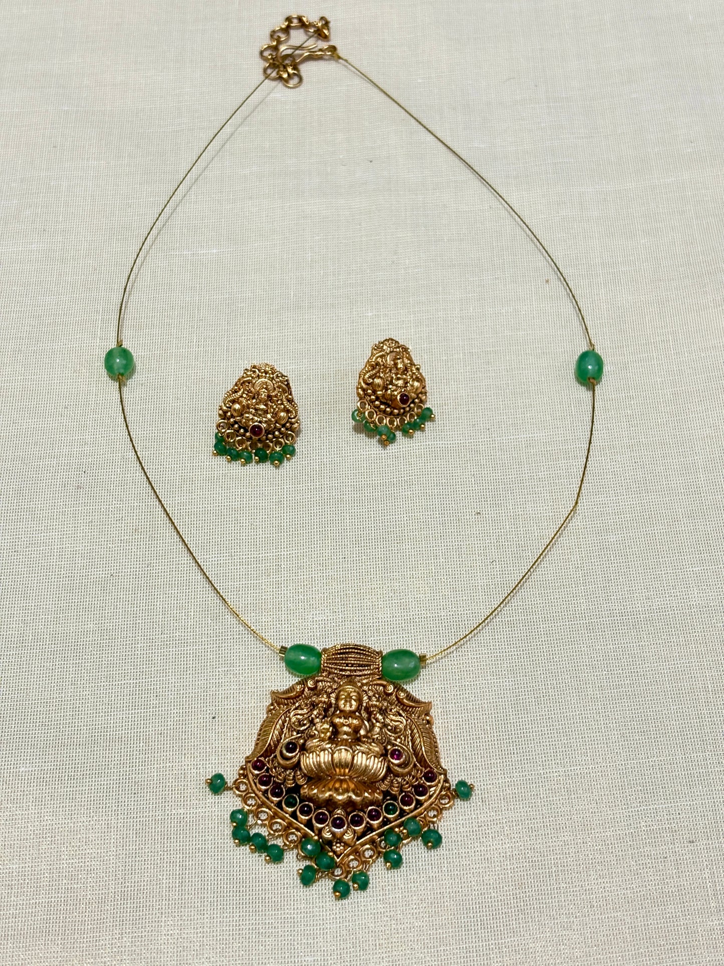 Ananya - Invisible Green Lakshmi Pendant Necklace Set with Matching Earrings