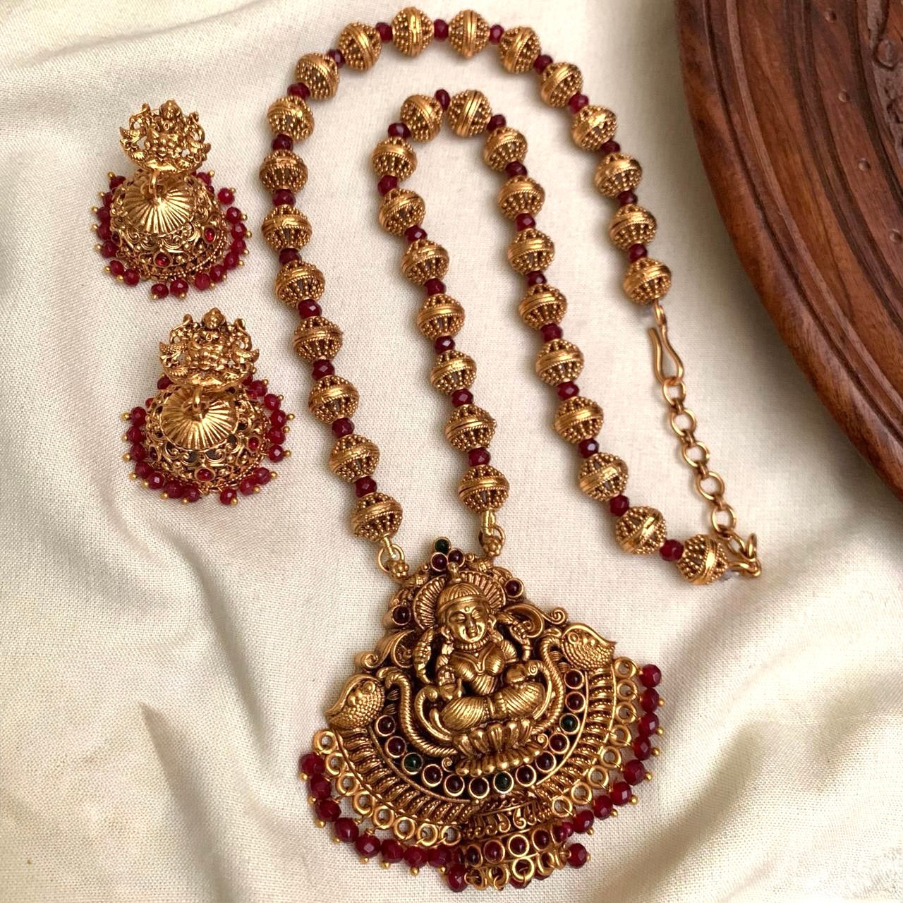 Indhu - Red Crystal Beads and Golden Beads Lakshmi Pendant Chain with Jhumka
