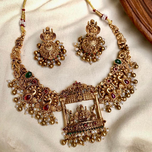 Rani - Peacock & Lakshmi Golden Statement Necklace Set with Jhumka Earrings