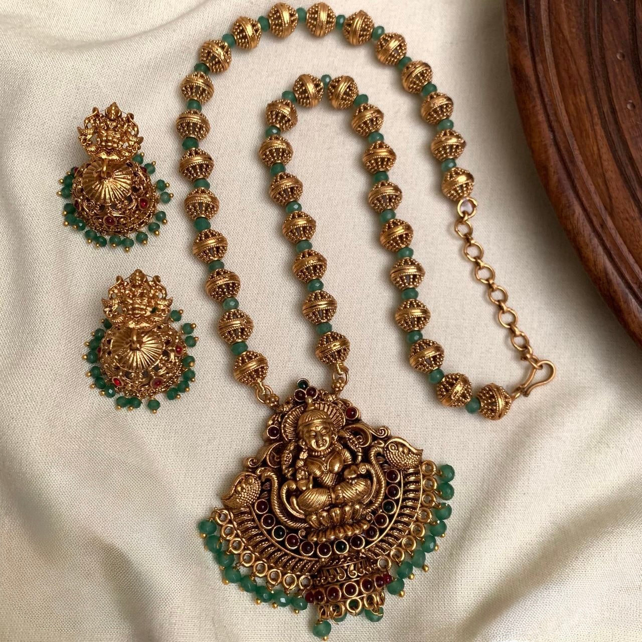 Indhu - Green Crystal Beads and Golden Beads Lakshmi Pendant Chain with Jhumka