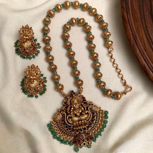 Indhu - Green Crystal Beads and Golden Beads Lakshmi Pendant Chain with Jhumka