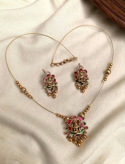 Vasudha - Invisible Pink and Green Lakshmi Necklace Set with Matching Earrings